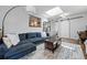 Comfortable living room with a skylight, modern furnishings, and stylish area rug at 1270 S Lowell Blvd, Denver, CO 80219