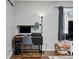 Cozy corner of the living room with a modern desk setup and plenty of natural light at 1270 S Lowell Blvd, Denver, CO 80219