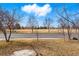 View of the street, common area, and large open field at 1270 S Lowell Blvd, Denver, CO 80219