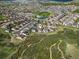 An aerial view of the neighborhood showing walking trails and community park space nearby this home at 1133 Lucky Ct, Castle Rock, CO 80109
