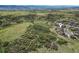 Aerial view showing the property's location in a neighborhood adjacent to a large open space area at 1133 Lucky Ct, Castle Rock, CO 80109