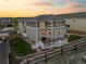 A well-maintained backyard features a lawn, patio with a grill, and a two-story home with abundant windows at 1133 Lucky Ct, Castle Rock, CO 80109