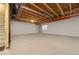 Unfinished basement with exposed beams, offering potential for customization and additional living space at 1133 Lucky Ct, Castle Rock, CO 80109