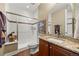 Bathroom featuring a walk-in shower, vanity with granite countertop, creating a functional and stylish space at 1133 Lucky Ct, Castle Rock, CO 80109