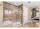 Bathroom with a glass enclosed walk-in shower that includes a built-in bench to complete the space at 1133 Lucky Ct, Castle Rock, CO 80109