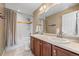 Bathroom features a shower-tub combo, double sinks and a large mirror providing functional spaces at 1133 Lucky Ct, Castle Rock, CO 80109