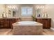 Beautiful bathroom featuring a soaking tub with tile surround, creating a luxurious spa-like retreat at 1133 Lucky Ct, Castle Rock, CO 80109