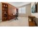 Bedroom featuring a Murphy bed with built-in shelving and a pull-out desk for working at 1133 Lucky Ct, Castle Rock, CO 80109
