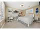 Bright bedroom with shelving, a desk, two windows with plantation shutters and a bed at 1133 Lucky Ct, Castle Rock, CO 80109