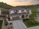 Beautiful two-story home features a two-car garage, inviting front porch, and professional landscaping for curb appeal at 1133 Lucky Ct, Castle Rock, CO 80109
