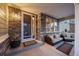 Inviting covered front porch with stone accents, comfortable seating, and stylish decor at 1133 Lucky Ct, Castle Rock, CO 80109