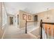 Carpeted hallway leading to other rooms, featuring recessed lighting, an art, and decorative chandelier at 1133 Lucky Ct, Castle Rock, CO 80109
