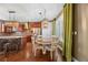 Kitchen eating area with wood table, chairs and stainless steel appliances at 1133 Lucky Ct, Castle Rock, CO 80109