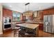 Spacious kitchen features modern appliances, mosaic backsplash and granite island at 1133 Lucky Ct, Castle Rock, CO 80109