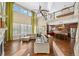 Bright, open living room featuring vaulted ceilings, lots of natural light, and hardwood flooring at 1133 Lucky Ct, Castle Rock, CO 80109