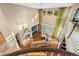 Sunlit living room boasts a fireplace, tall windows, a ceiling fan and comfortable sectional seating at 1133 Lucky Ct, Castle Rock, CO 80109