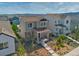 Aerial view of a two-story home with well-kept landscaping and mountain views at 8018 Williams Fork Ave, Littleton, CO 80125