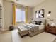Inviting bedroom with a neutral color scheme, large window, and contemporary furniture at 8018 Williams Fork Ave, Littleton, CO 80125