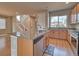 Kitchen with granite counters, stainless steel appliances, and wooden cabinets at 8018 Williams Fork Ave, Littleton, CO 80125