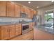Kitchen features granite counters, stainless steel appliances, and wooden cabinets at 8018 Williams Fork Ave, Littleton, CO 80125