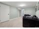 Basement with a comfortable sectional sofa, neutral color, and carpeted floor at 20349 E Powers Pl, Centennial, CO 80015