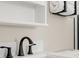 Close-up of bathroom sink with sleek, black faucet and marble countertop at 20349 E Powers Pl, Centennial, CO 80015