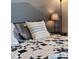 Bedroom close-up featuring decorative pillows and cozy quilt on bed at 20349 E Powers Pl, Centennial, CO 80015