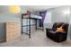 Bedroom with lofted bed, accent chair, and a large dresser at 20349 E Powers Pl, Centennial, CO 80015