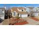 Charming two-story home featuring manicured landscaping, mature trees, and an attached two-car garage at 20349 E Powers Pl, Centennial, CO 80015