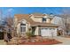 Charming two-story home with manicured front yard, two car garage, and inviting curb appeal at 20349 E Powers Pl, Centennial, CO 80015