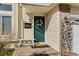 Charming front porch featuring a decorative wreath, bench, and seasonal decorations at 20349 E Powers Pl, Centennial, CO 80015