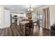 Bright open floor plan boasts a dining area and kitchen featuring stainless appliances and center island at 20349 E Powers Pl, Centennial, CO 80015