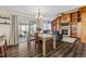 This living room has built-in bookshelves, a fireplace, and sliding doors to the sunroom at 20349 E Powers Pl, Centennial, CO 80015