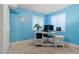 Bright office space with a white desk, chair, computer and natural light at 20349 E Powers Pl, Centennial, CO 80015
