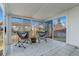 Sunroom featuring lounge chairs, glass windows, and a rug on a tiled floor at 20349 E Powers Pl, Centennial, CO 80015