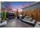 Landscaped backyard with fire pit, grill, and water feature at 8056 E 35Th Ave, Denver, CO 80238