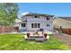 Backyard featuring a well-maintained lawn, patio, and outdoor seating, perfect for entertaining at 11670 S Flower Mound Way, Parker, CO 80134