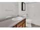Bathroom featuring white tile, a shower-tub, vanity, and updated fixtures at 11670 S Flower Mound Way, Parker, CO 80134