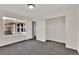 Bedroom featuring natural light, carpeting, closet, and light-colored walls at 11670 S Flower Mound Way, Parker, CO 80134