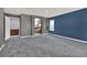 Spacious bedroom features neutral carpet and a walk-in closet with ensuite bathroom at 11670 S Flower Mound Way, Parker, CO 80134