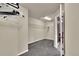 Walk-in closet featuring carpeted floor, shelving and a light at 11670 S Flower Mound Way, Parker, CO 80134