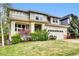 Charming two-story home with manicured lawn and lovely landscaping at 11670 S Flower Mound Way, Parker, CO 80134