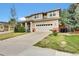 Charming two-story home with landscaped front yard and attached two-car garage at 11670 S Flower Mound Way, Parker, CO 80134