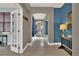 Inviting hallway with archway and view to the backyard at 11670 S Flower Mound Way, Parker, CO 80134