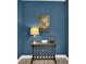 Cozy corner with a dark table, lamp, and decorative map against a blue wall at 11670 S Flower Mound Way, Parker, CO 80134