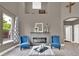 Comfortable living room featuring a fireplace and natural light from the window at 11670 S Flower Mound Way, Parker, CO 80134
