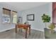 Bright home office with ample natural light, stylish desk, and decor at 11670 S Flower Mound Way, Parker, CO 80134