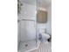 Modern bathroom featuring a glass-enclosed shower with subway tile, mosaic tile floor, and a sleek toilet at 2801 Champa St, Denver, CO 80205