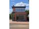 Contemporary brick building showcases large windows and modern design, ideal for retail or office with great curb appeal at 2801 Champa St, Denver, CO 80205