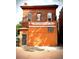 Charming red brick two-story building featuring a 